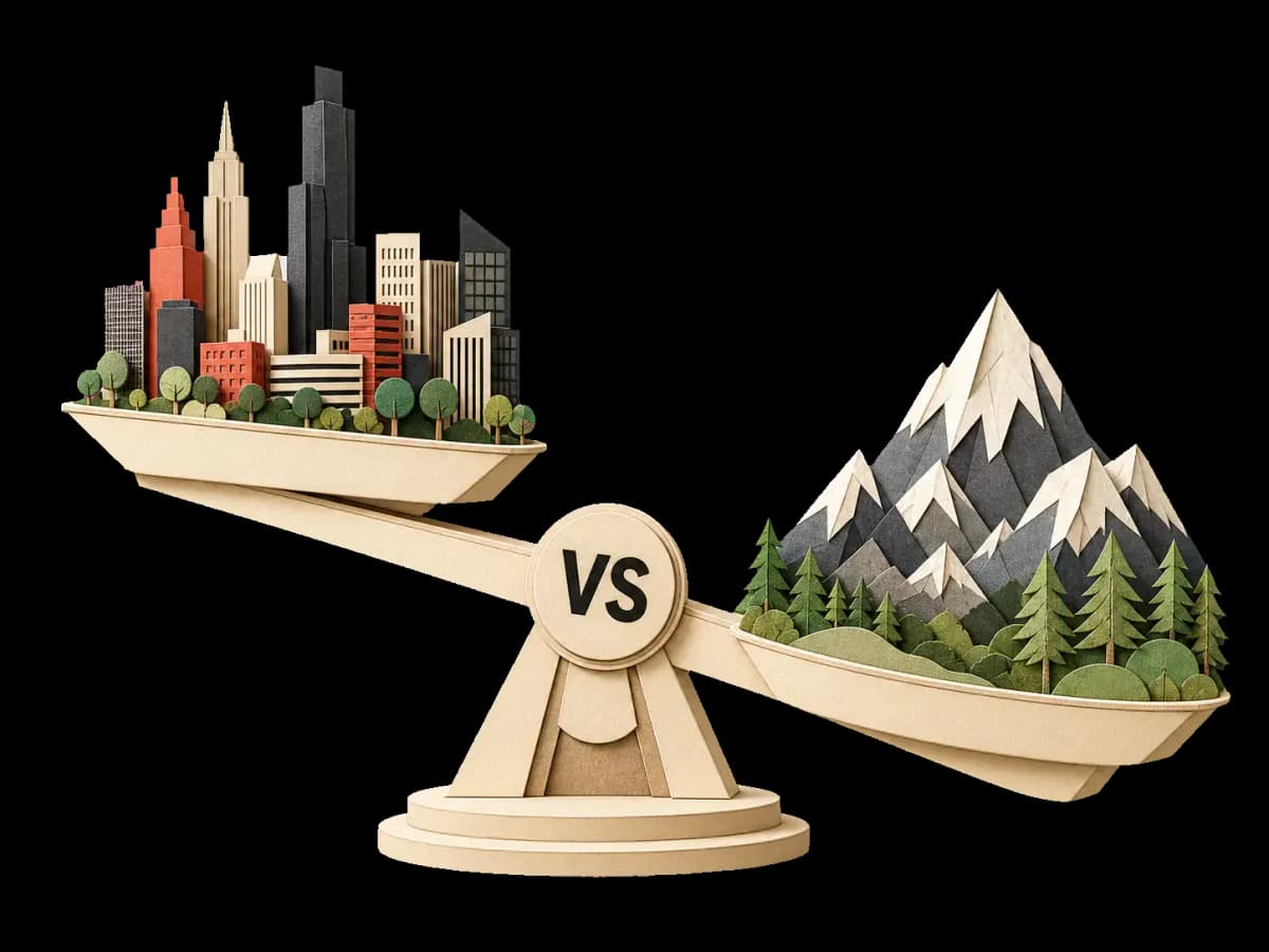 A paper-cut balance scale weighing a city skyline against a mountain landscape